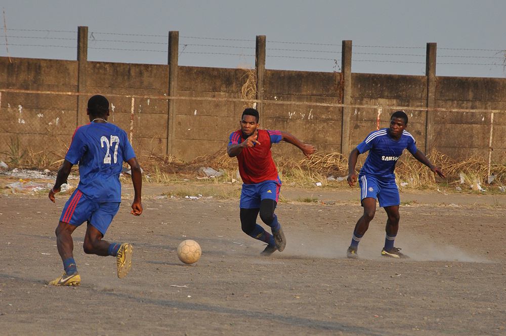 Uros Kovac - football, training, Buea, 2015. Footballers hard at training at the town stadium. The young athletes dream of places afar and are ready to migrate at all costs. Buea, Cameroon, February 2015. Photo courtesy Uroš Kovač.