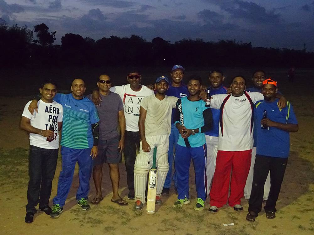 Guyanese and Trinidadian cricketers celebrate after a local fête (friendly) match in Trinidad, April 2015 (Photo Adnan Hossain)