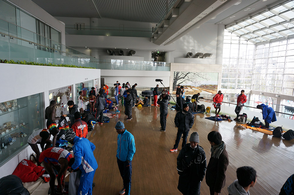 Runners, coaches, agents, and the media before race time